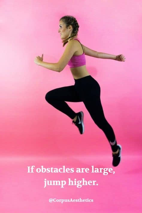 fitspirational quote, If obstacles are large, jump higher, a girl has a training by jumping in the gym